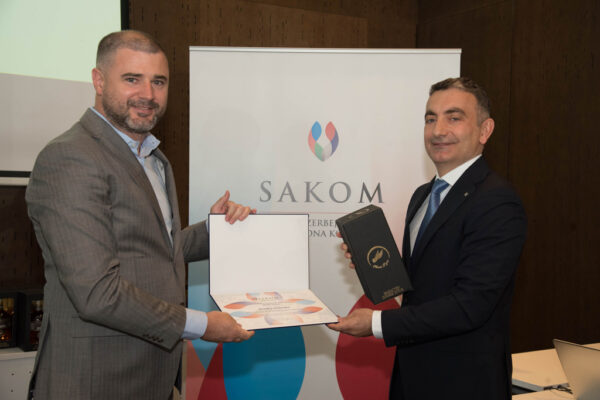 41 Mr. Branko Armenko receiving the certificate of appreciation and Duboki Potok Monastery’s brandy (rakija).