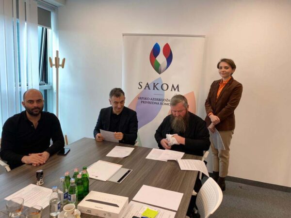 The signing of the donation agreement between Mr. Ahmet Murat Turkoglu, SAKOM President, and Protosyncellus Abbot Damjan.